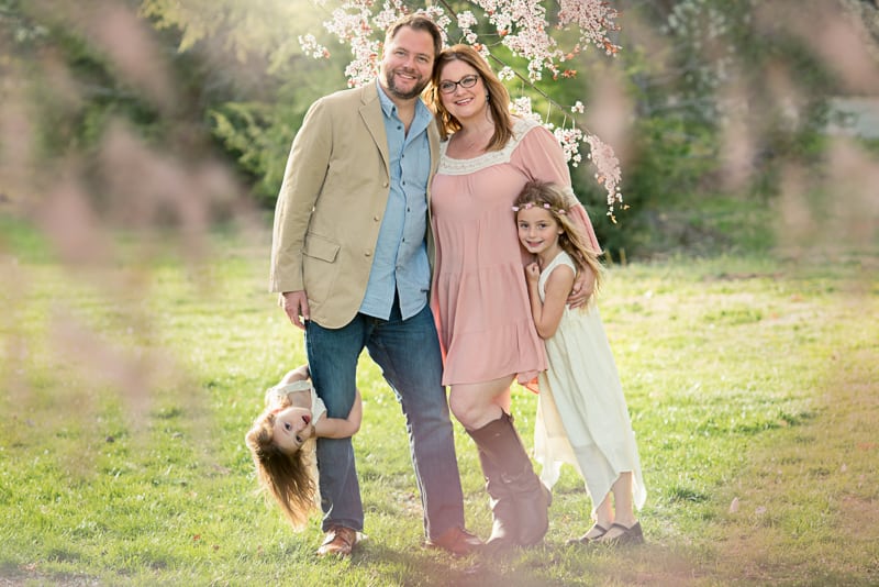 posed family picture wearing spring outfits