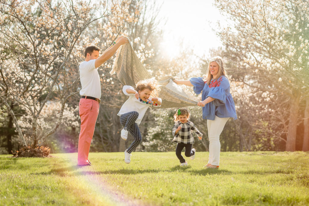 family playing with their kids in spring